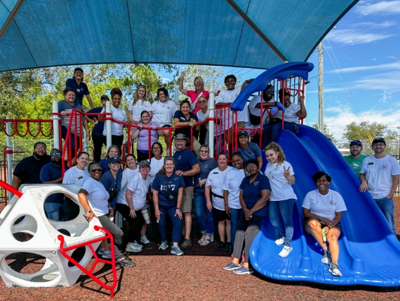 members of the Walton Communities team at a school playground