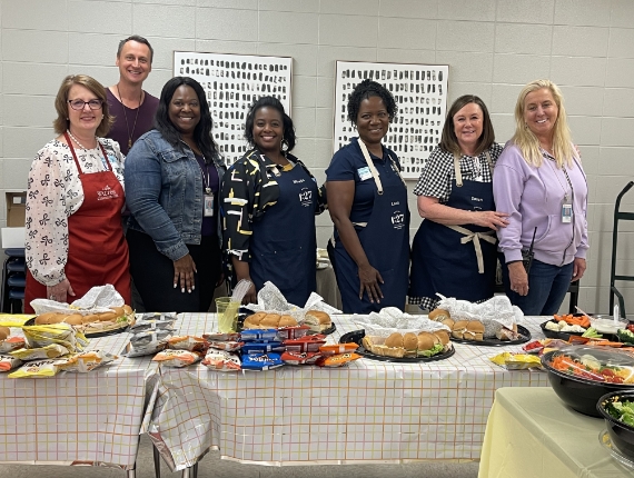 members of the Walton Communities team at a potluck