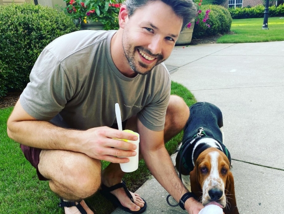 a man and a beagle eating ice cream